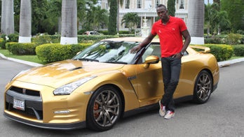 Usain Bolt on his gold Nissan GT-R and girl getting sick in his BMW