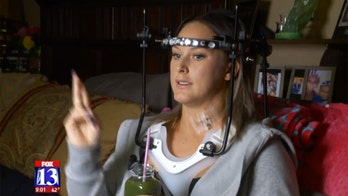 Mom walks out of hospital days after breaking vertebrae in freak gymnastics accident