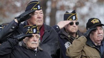 Biden signs law expanding COVID-19 vaccinations for veterans, their spouses and caregivers