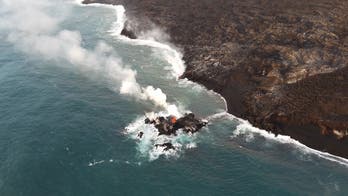 Hawaii volcano eruption forms new lava 'island' just off coast