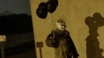 Clown carrying black balloons gives Wisconsin city the creeps
