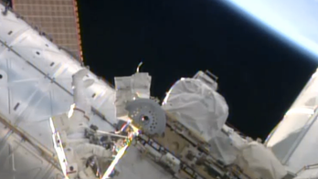 Spacewalking astronauts upgrade space station