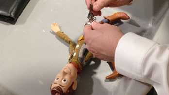 Heathrow airport security confiscates mini gun from 'Toy Story' Woody doll