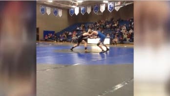 Minnesota high school wrestler paralyzed in freak accident learns to walk again