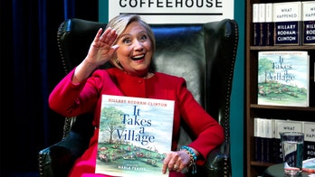 Hillary Clinton meets young pantsuit-sporting fan at children's book signing
