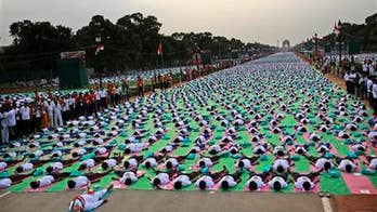 Millions of people bend and twist their bodies for Yoga Day