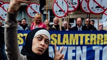 Muslim woman behind viral selfie hailed as heroine -- until hateful Tweets revealed