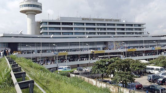 Intruder detained after jumping on wing of Nigeria plane prior to takeoff