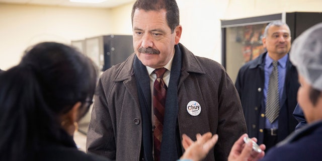 CHICAGO, IL - FEBRUARY 23: Chicago Mayoral candidate Jesus "Chuy" Garcia greets workers during a campaign stop at a linen and uniform service company on February 23, 2015 in Chicago, Illinois. Recent polls show Garcia is running second to incumbent Mayor Rahm Emanuel whose lead is not currently large enough to avoid a runoff election. Chicago residents go to the polls Tuesday, February 24. (Photo by Scott Olson/Getty Images)