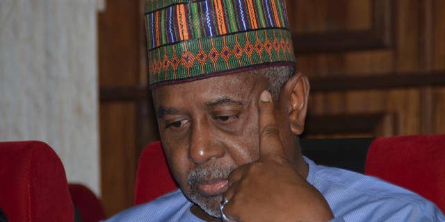 FILE- In this Tuesday, Sept.1, 2015 file photo, Nigeria's former national security adviser Sambo Dasuki attends a hearing to face charges of possessing weapons illegally, at the Federal High Court in Abuja, Nigeria. Nigeria’s former national security adviser pleaded not guilty to money laundering Monday in connection with $423,000 in U.S. dollars and Nigerian naira seized at his homes. (AP Photo file)