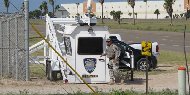 A Texas National Guardsman exits an observation tower in Hidalgo, Texas, on Thursday, Aug. 14, 2014. Several dozen soldiers deployed in the Rio Grande Valley are part of the up to 1,000 troops called up by Gov. Rick Perry last month, Texas National Guard Master Sgt. Ken Walker of the Joint Counterdrug Task Force said Thursday. (AP Photo/Christopher Sherman)