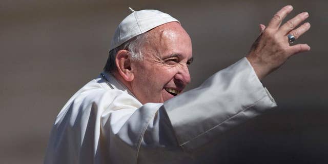 Pope Francis waves to the crowd as he arrives for his weekly general audience in St. Peter's Square at the Vatican, Wednesday, May 18, 2016. (AP Photo/Alessandra Tarantino)