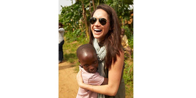 Meghan Markle befriending a local child.