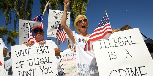 June 5: Arizona residents rally in support of the state's new immigration law near the state capitol in Phoenix.