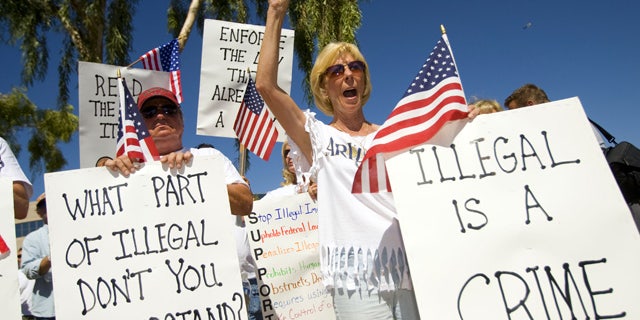June 5: Arizona residents rally in support of the state's new immigration law near the state capitol in Phoenix.
