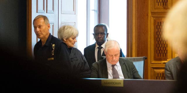 This is  Sept. 16, 2015  file picture shows Claver Berinkindi, second from right a Swedish citizen originally from Rwanda. Claver Berinkindi on Monday May 16, 2016  was found guilty of genocide and gross violation of international law. The Stockholm district court said the 61-year-old was an informal low-level Hutu leader who took part in massacres of civilians in Muyira and Butare in southern Rwanda.. (Jessica Gow/TT via AP) SWEDEN OUT