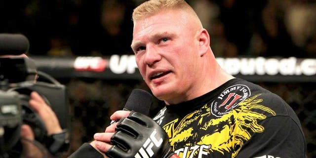 LAS VEGAS, NV - DECEMBER 30: Brock Lesnar announces his retirement in the Octagon after losing to Alistair Overeem during the UFC 141 event at the MGM Grand Garden Arena on December 30, 2011 in Las Vegas, Nevada. (Photo by Josh Hedges/Zuffa LLC/Zuffa LLC via Getty Images)