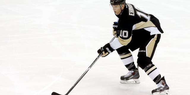Dec 2, 2014; Pittsburgh, PA, USA; Pittsburgh Penguins defenseman Christian Ehrhoff (10) skates with the puck against the New Jersey Devils during the second period at the CONSOL Energy Center. The Penguins won 1-0. Mandatory Credit: Charles LeClaire-USA TODAY Sports