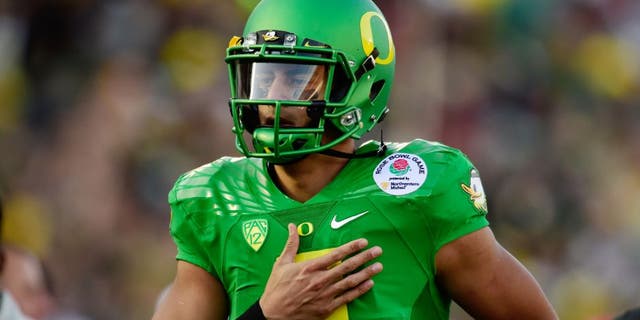 Jan 1, 2015; Pasadena, CA, USA; Oregon Ducks quarterback Marcus Mariota (8) runs off the field following the first half of the 2015 Rose Bowl college football game at Rose Bowl. Mandatory Credit: Robert Hanashiro-USA TODAY Sports