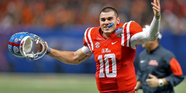 Jan 1, 2016; New Orleans, LA, USA; Mississippi Rebels quarterback Chad Kelly (10) gestures while running off the field at the end of the the second quarter against the Oklahoma State Cowboys in the 2016 Sugar Bowl at the Mercedes-Benz Superdome. Mandatory Credit: Chuck Cook-USA TODAY Sports