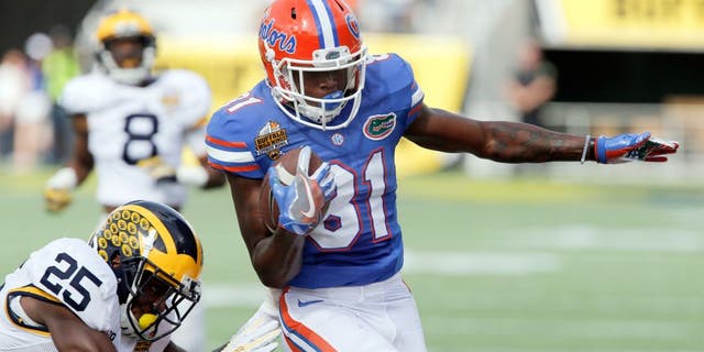 Jan 1, 2016; Orlando, FL, USA;Florida Gators wide receiver Antonio Callaway (81) runs around Michigan Wolverines safety Dymonte Thomas (25) during the first quarter in the 2016 Citrus Bowl at Orlando Citrus Bowl Stadium. Mandatory Credit: Reinhold Matay-USA TODAY Sports