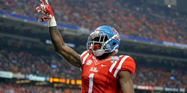 Jan 1, 2016; New Orleans, LA, USA; Mississippi Rebels wide receiver Laquon Treadwell (1) celebrates his ten-yard touchdown catch against the Oklahoma State Cowboys in the second quarter of the 2016 Sugar Bowl at the Mercedes-Benz Superdome. Mandatory Credit: Chuck Cook-USA TODAY Sports
