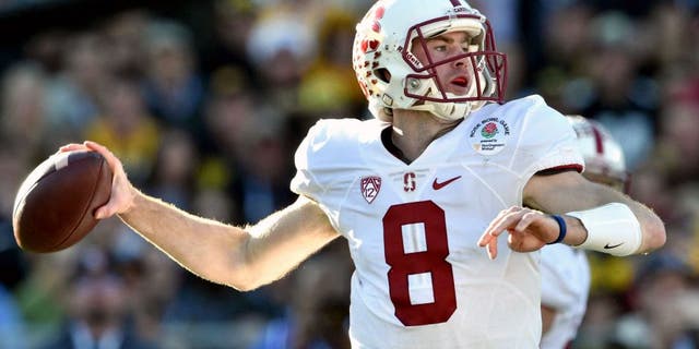 Jan 1, 2016; Pasadena, CA, USA; Stanford Cardinal quarterback Kevin Hogan (8) drops back to pass against the Iowa Hawkeyes during the second quarter in the 2016 Rose Bowl at Rose Bowl. Mandatory Credit: Kirby Lee-USA TODAY Sports
