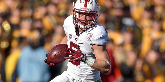Jan 1, 2016; Pasadena, CA, USA; Stanford Cardinal running back Christian McCaffrey (5) runs against the Iowa Hawkeyes during the first quarter in the 2016 Rose Bowl at Rose Bowl. Mandatory Credit: Kirby Lee-USA TODAY Sports