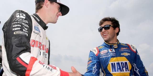 INDIANAPOLIS, IN - JULY 25: Ryan Blaney, driver of the #22 Discount Tire Ford, and Chase Elliott, driver of the #9 NAPA Auto Parts Chevrolet, speak on the grid prior to the NASCAR XFINITY Series Lilly Diabetes 250 at Indianapolis Motor Speedway on July 25, 2015 in Indianapolis, Indiana. (Photo by Brian Lawdermilk/Getty Images)