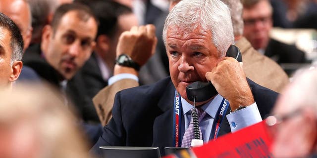 SUNRISE, FL - JUNE 26: General Manager Dale Tallon of the Florida Panthers talks on the phone at the draft table during Round One of the 2015 NHL Draft at BB&T Center on June 26, 2015 in Sunrise, Florida. (Photo by Eliot J. Schechter/NHLI via Getty Images)