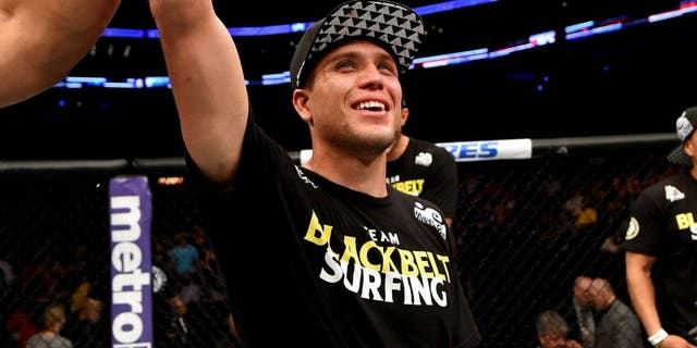 NEW ORLEANS, LA - JUNE 06: Brian Ortega celebrates his victory over Thiago Tavares in their featherweight bout during the UFC event at the Smoothie King Center on June 6, 2015 in New Orleans, Louisiana. (Photo by Josh Hedges/Zuffa LLC/Zuffa LLC via Getty Images)