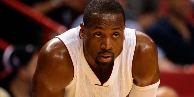 Dec 28, 2015; Miami, FL, USA; Miami Heat guard Dwyane Wade (3) takes a breather during the first half against the Brooklyn Nets at American Airlines Arena. Mandatory Credit: Steve Mitchell-USA TODAY Sports