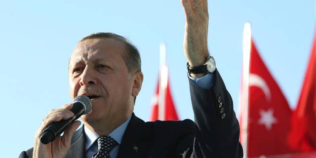 Turkey's President Recep Tayyip Erdogan addresses a rally in Sanliurfa, Turkey, Friday, Jan. 6, 2017. Turkey's justice minister Bekir Bozdag says police have detained 18 people in connection with a foiled attack at courthouse in the western city of Izmir that nevertheless killed a policeman and a courthouse employee. Addressing crowds in Sanliurfa, near the border with Syria, Erdogan reiterated claims that unidentified forces wanting to forestall Turkey's rise were behind such attacks. (Yasin Bulbul/Presidential Press Service, Pool photo via AP)