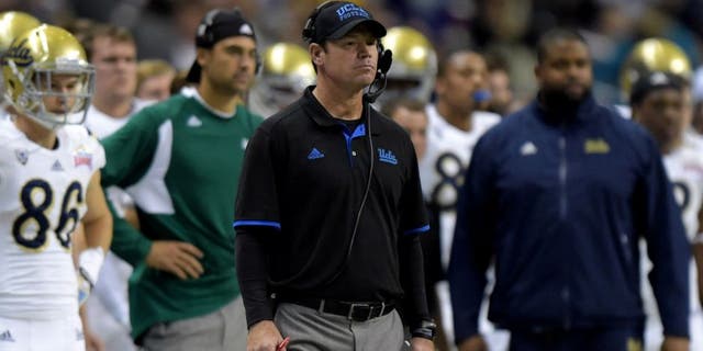 Jan 2, 2015; San Antonio, TX, USA; UCLA Bruins coach Jim Mora watches on the sidelines against the Kansas State Wildcats in the 2015 Alamo Bowl at Alamodome. UCLA defeated Kansas State 40-35. Mandatory Credit: Kirby Lee-USA TODAY Sports