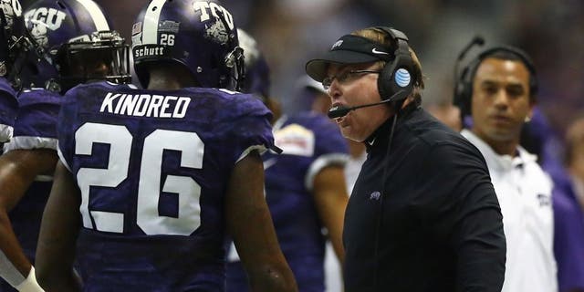 SAN ANTONIO, TX - JANUARY 02: Head coach Gary Patterson of the TCU Horned Frogs talks with Derrick Kindred #26 during the Valero Alamo Bowl at Alamodome on January 2, 2016 in San Antonio, Texas. (Photo by Ronald Martinez/Getty Images)