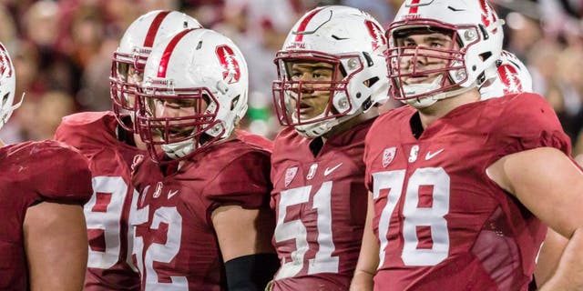 PALO ALTO, CA - OCTOBER 15: The Stanford Cardinal offense awaits the play call during a PAC-12 football game against the UCLA Bruins on October 15, 2015 at Stanford Stadium on the campus of Stanford University in Palo Alto, California. Visible players include Casey Tucker #77, Johnny Caspers #57, Graham Shuler #52, Joshua Garnett #51, and Kyle Murphy #78. (Photo by David Madison/Getty Images)
