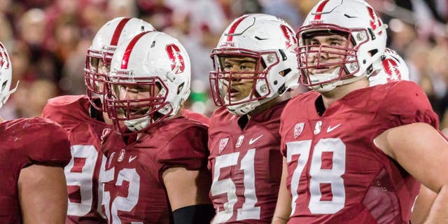 PALO ALTO, CA - OCTOBER 15: The Stanford Cardinal offense awaits the play call during a PAC-12 football game against the UCLA Bruins on October 15, 2015 at Stanford Stadium on the campus of Stanford University in Palo Alto, California. Visible players include Casey Tucker #77, Johnny Caspers #57, Graham Shuler #52, Joshua Garnett #51, and Kyle Murphy #78. (Photo by David Madison/Getty Images)