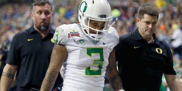Jan 2, 2016; San Antonio, TX, USA; Oregon Ducks quarterback Vernon Adams, Jr. (3) is helped off the field after a hit against the TCU Horned Frogs in the 2016 Alamo Bowl at the Alamodome. Adams was taken out of the game. Mandatory Credit: Erich Schlegel-USA TODAY Sports