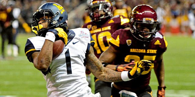 Jan 2, 2016; Phoenix, AZ, USA; West Virginia Mountaineers wide receiver Shelton Gibson (1) runs for a touchdown as Arizona State Sun Devils defensive back Kweishi Brown (10) and defensive back Kareem Orr (25) pursue during the first half at Chase Field during the Cactus Bowl. Mandatory Credit: Matt Kartozian-USA TODAY Sports