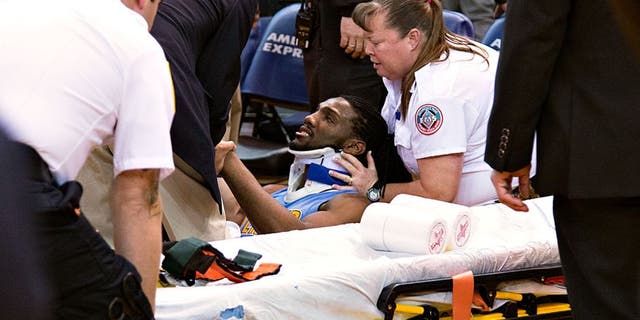 January 2, 2016; Oakland, CA, USA; Denver Nuggets forward Kenneth Faried (35) receives medical attention after the game against the Golden State Warriors at Oracle Arena. The Warriors defeated the Nuggets 111-108 in overtime. Mandatory Credit: Kyle Terada-USA TODAY Sports