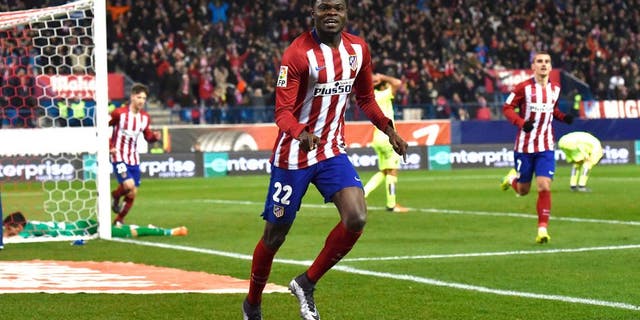 Atletico Madrid's Ghanaian midfielder Thomas Partey celebrates after scoring during the Spanish league football match Club Atletico de Madrid vs Leg vante UD at the Vicente Calderon stadium in Madrid on January 2, 2016. AFP PHOTO/ GERARD JULIEN / AFP / GERARD JULIEN (Photo credit should read GERARD JULIEN/AFP/Getty Images)