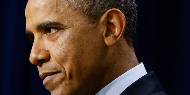 President Barack Obama pauses as he speaks about the fiscal cliff, Monday, Dec. 31, 2012, in the South Court Auditorium at the White House in Washington. The president said it appears that an agreement to avoid the fiscal cliff is "in sight," but says it's not yet complete and work continues. (AP Photo/Charles Dharapak)