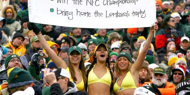 GREEN BAY, WI - DECEMBER 27: Fans of the Green Bay Packers hold a sign and wear bikini's in below freezing weather during a game between the Packers and the Seattle Seahawks at Lambeau Field on December 27, 2009 in Green Bay, Wisconsin. The Packers defeated the Seahawks 48-10. (Photo by Jonathan Daniel/Getty Images)