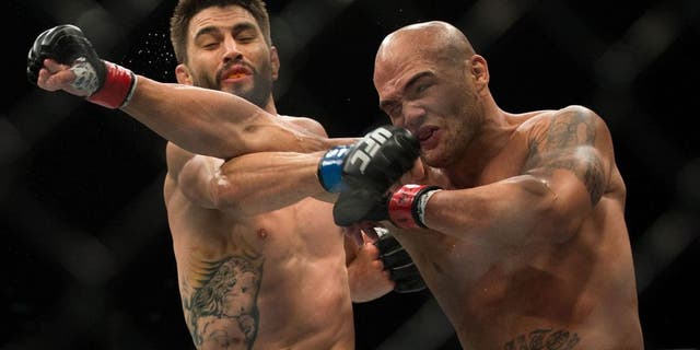 LAS VEGAS, NV - JANUARY 02: (R-L) Robbie Lawler exchanges punches with Carlos Condit in their welterweight championship fight during the UFC 195 event inside MGM Grand Garden Arena on January 2, 2016 in Las Vegas, Nevada. (Photo by Brandon Magnus/Zuffa LLC/Zuffa LLC via Getty Images)