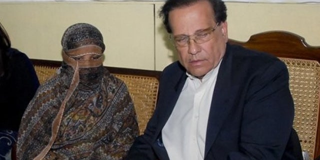 Nov. 20: Salman Taseer, right, Governor of Pakistani Punjab Province, listens to Pakistani Christian woman Asia Bibi, left, at a prison in Sheikhupura near Lahore, Pakistan.