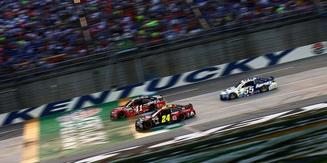 SPARTA, KY - JULY 11: Kurt Busch, driver of the #41 Haas Automation Chevrolet, Jeff Gordon, driver of the #24 AARP Member Advantages Chevrolet, and David Ragan, driver of the #55 Aaron's Dream Machine Toyota, race during the NASCAR Sprint Cup Series Quaker State 400 presented by Advance Auto Parts at Kentucky Speedway on July 11, 2015 in Sparta, Kentucky. (Photo by Sarah Crabill/Getty Images)