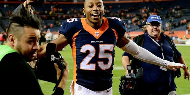 Nov 1, 2015; Denver, CO, USA; Denver Broncos cornerback Chris Harris (25) reacts following the win over the Green Bay Packers at Sports Authority Field at Mile High. The Broncos defeated the Packer 29-10. Mandatory Credit: Ron Chenoy-USA TODAY Sports
