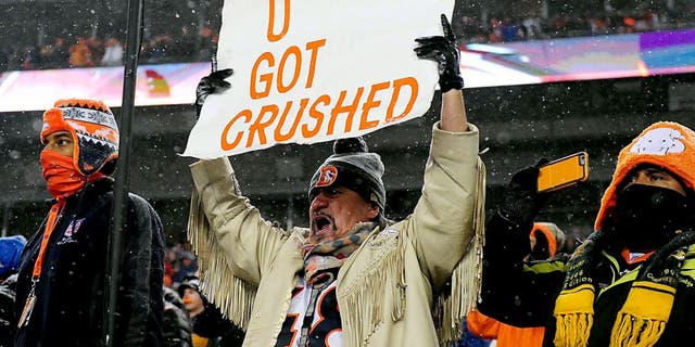 Nov 29, 2015; Denver, CO, USA; Denver Broncos fan holds a sign towards the New England Patriots bench during a overtime period at Sports Authority Field at Mile High. The Broncos defeated the Patriots 30-24 in overtime. Mandatory Credit: Ron Chenoy-USA TODAY Sports