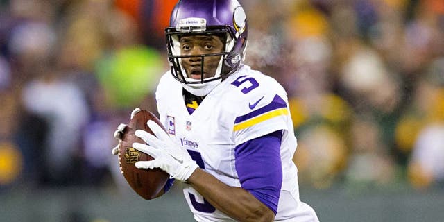Jan 3, 2016; Green Bay, WI, USA; Minnesota Vikings quarterback Teddy Bridgewater (5) looks to pass during the first quarter against the Green Bay Packers at Lambeau Field. Mandatory Credit: Jeff Hanisch-USA TODAY Sports