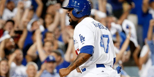 LOS ANGELES, CA - OCTOBER 10: Howie Kendrick #47 of the Los Angeles Dodgers celebrates after he slides home safely to score on a two-RBI double by Adrian Gonzalez #23 of the Los Angeles Dodgers in the seventh inning against the New York Mets in game two of the National League Division Series at Dodger Stadium on October 10, 2015 in Los Angeles, California. (Photo by Sean M. Haffey/Getty Images)